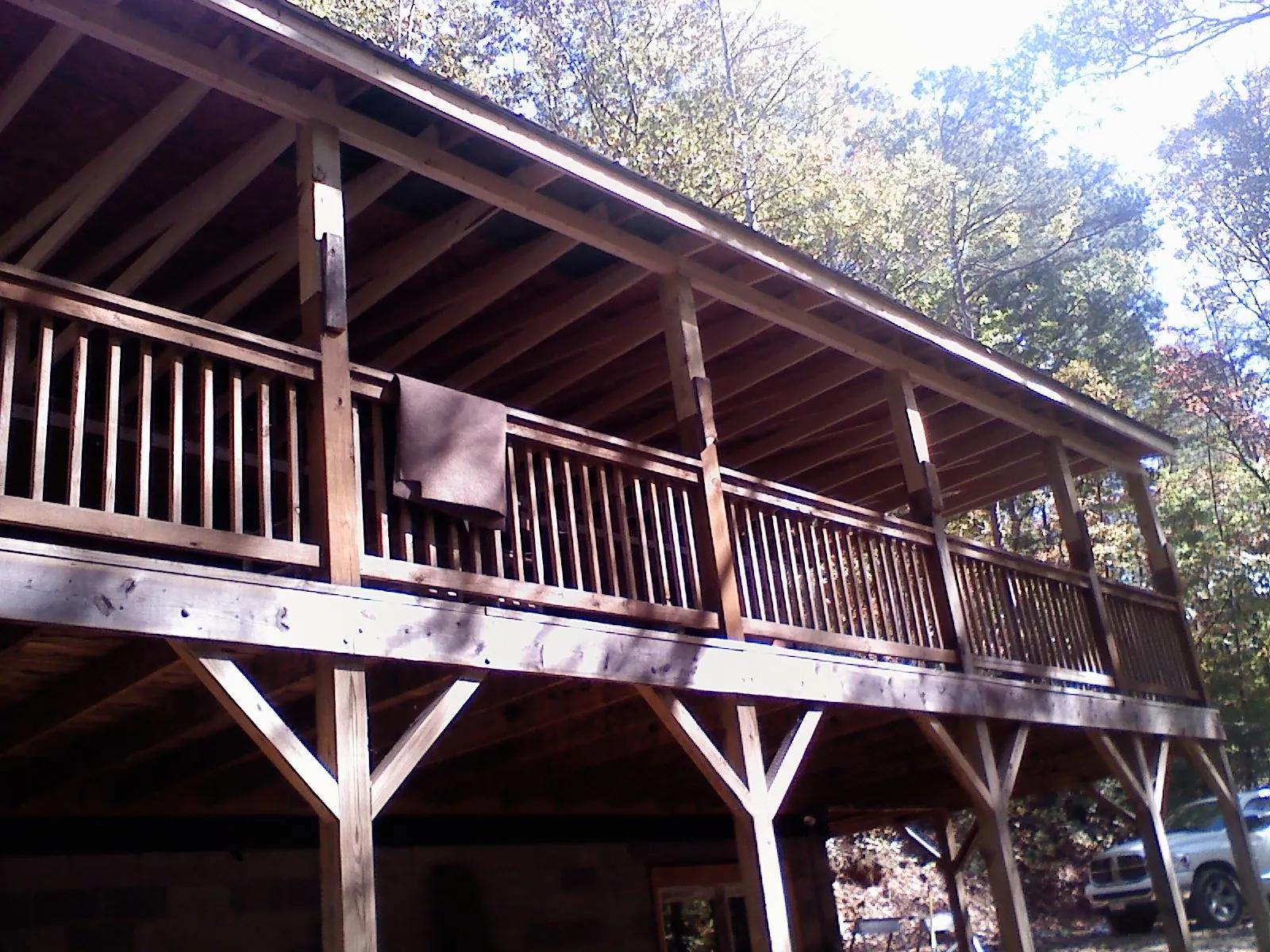 Timber framing under a new elevated porch and deck — Roof Leak Repair in Saratoga Springs by Roofing Brothers